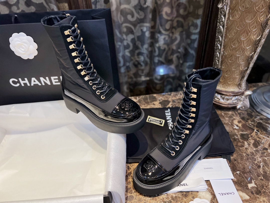 Chanel Martin Boots: The Patent Leather Toe Instantly Adds Refinement to the Overall Look. 