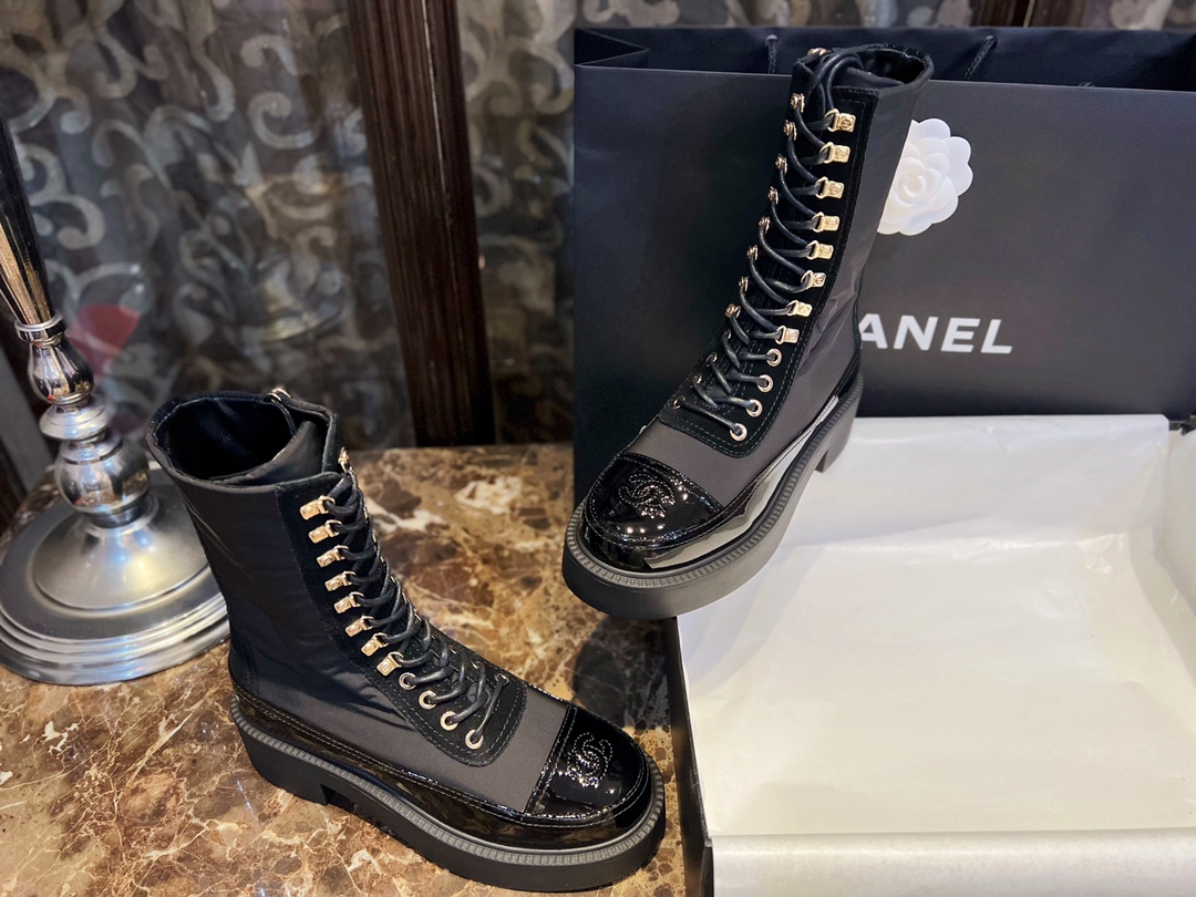 Chanel Martin Boots: The Patent Leather Toe Instantly Adds Refinement to the Overall Look. 