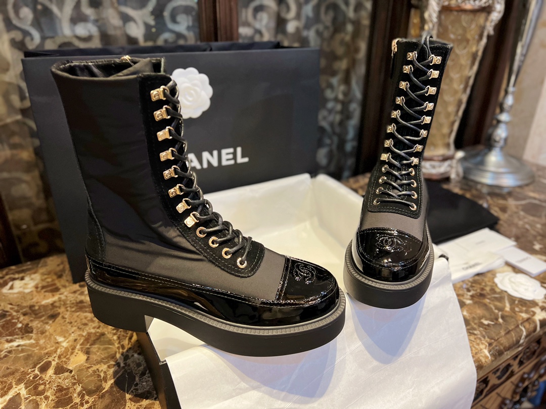 Chanel Martin Boots: The Patent Leather Toe Instantly Adds Refinement to the Overall Look. 