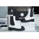 Chanel 22c Chunky Black and White Spliced Slip-On Short Boots: Featuring Rich Texture Inside and Out, with Delicate Sheepskin and Glossy Patent Leather. Exuding Understated Sophistication