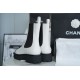 Chanel 22c Chunky Black and White Spliced Slip-On Short Boots: Featuring Rich Texture Inside and Out, with Delicate Sheepskin and Glossy Patent Leather. Exuding Understated Sophistication