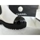 Chanel 22c Chunky Black and White Spliced Slip-On Short Boots: Featuring Rich Texture Inside and Out, with Delicate Sheepskin and Glossy Patent Leather. Exuding Understated Sophistication