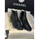 Chanel 23a Crinkled Patent Leather Chelsea Boots: A pair of understated yet exquisitely crafted ankle boots. Featuring sleek black patent leather with subtle gloss, minimalist design with only a brand logo decoration on the vamp. The interior is lined wit