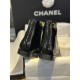 Chanel 23a Crinkled Patent Leather Chelsea Boots: A pair of understated yet exquisitely crafted ankle boots. Featuring sleek black patent leather with subtle gloss, minimalist design with only a brand logo decoration on the vamp. The interior is lined wit