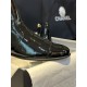 Chanel 23a Crinkled Patent Leather Chelsea Boots: A pair of understated yet exquisitely crafted ankle boots. Featuring sleek black patent leather with subtle gloss, minimalist design with only a brand logo decoration on the vamp. The interior is lined wit