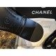 Chanel 23a Crinkled Patent Leather Chelsea Boots: A pair of understated yet exquisitely crafted ankle boots. Featuring sleek black patent leather with subtle gloss, minimalist design with only a brand logo decoration on the vamp. The interior is lined wit