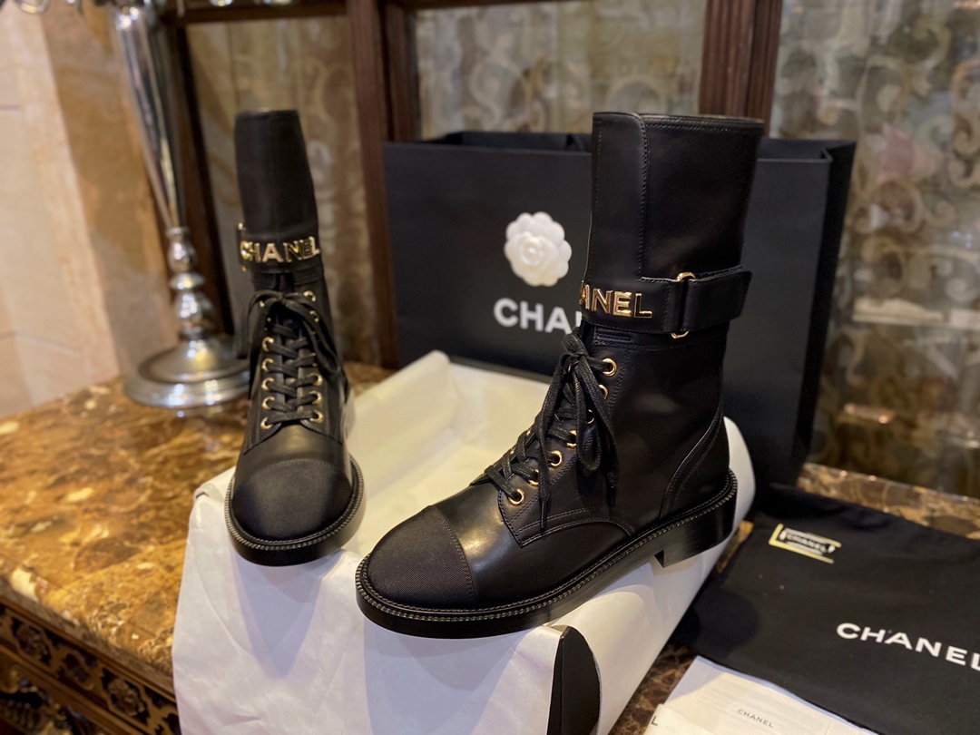 Chanel  Letter Logo Lace-Up Boots: A pair of classic and fashionable long boots with a unique and elegant design