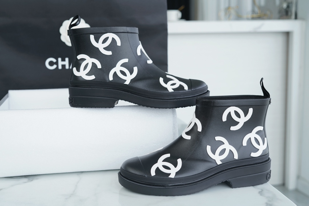 Chanel 23a Black Double C Full Logo Short Rain Boots: Made with Environmentally Friendly Lightweight Rubber Imported from Italy, Inner Fabric Lining Provides Softness, Giving a Feeling of Walking on Clouds. The Displaced Distribution of Logos Instantly El