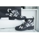 Chanel 23a Black Double C Full Logo Short Rain Boots: Made with Environmentally Friendly Lightweight Rubber Imported from Italy, Inner Fabric Lining Provides Softness, Giving a Feeling of Walking on Clouds. The Displaced Distribution of Logos Instantly El