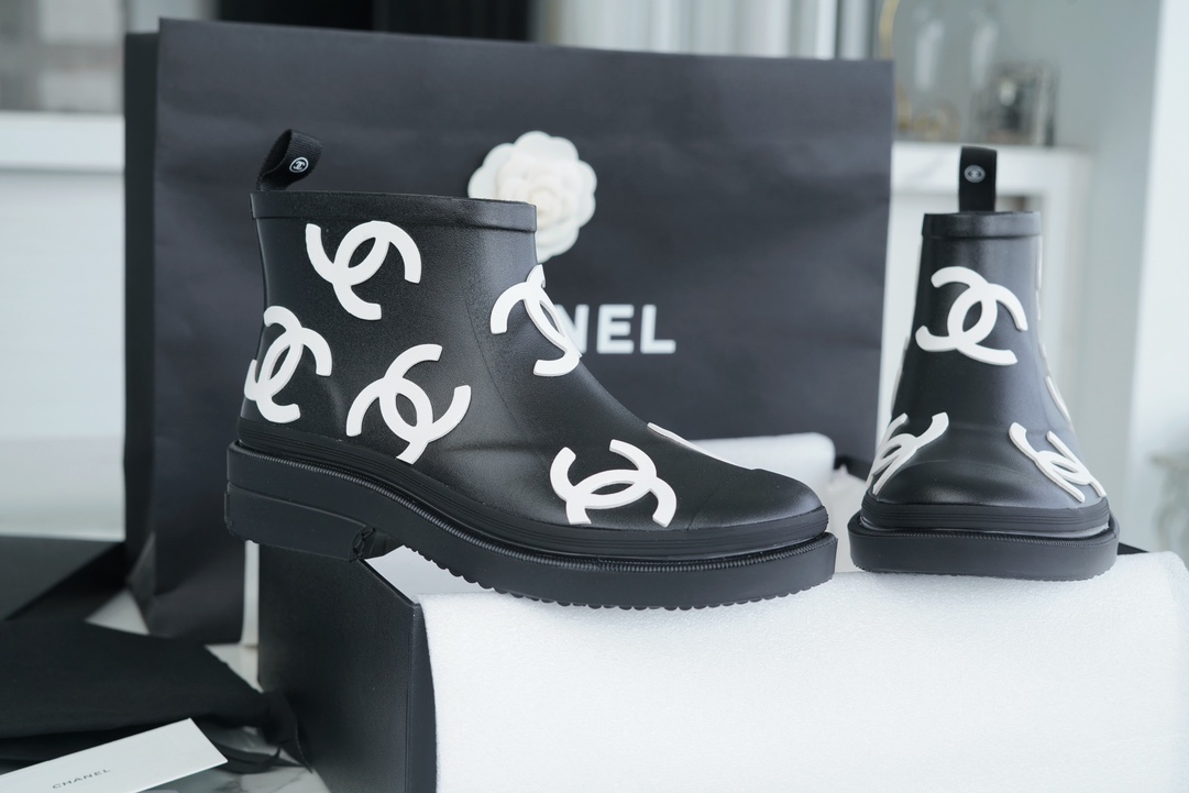 Chanel 23a Black Double C Full Logo Short Rain Boots: Made with Environmentally Friendly Lightweight Rubber Imported from Italy, Inner Fabric Lining Provides Softness, Giving a Feeling of Walking on Clouds. The Displaced Distribution of Logos Instantly El