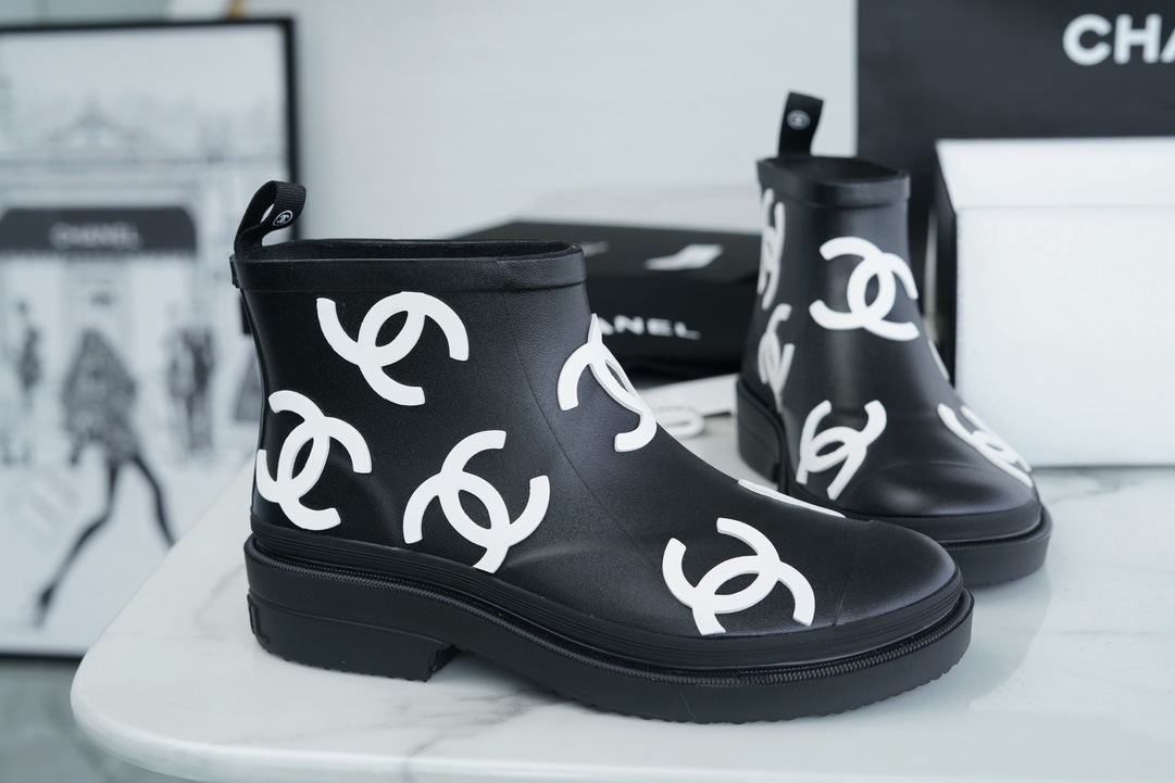 Chanel 23a Black Double C Full Logo Short Rain Boots: Made with Environmentally Friendly Lightweight Rubber Imported from Italy, Inner Fabric Lining Provides Softness, Giving a Feeling of Walking on Clouds. The Displaced Distribution of Logos Instantly El