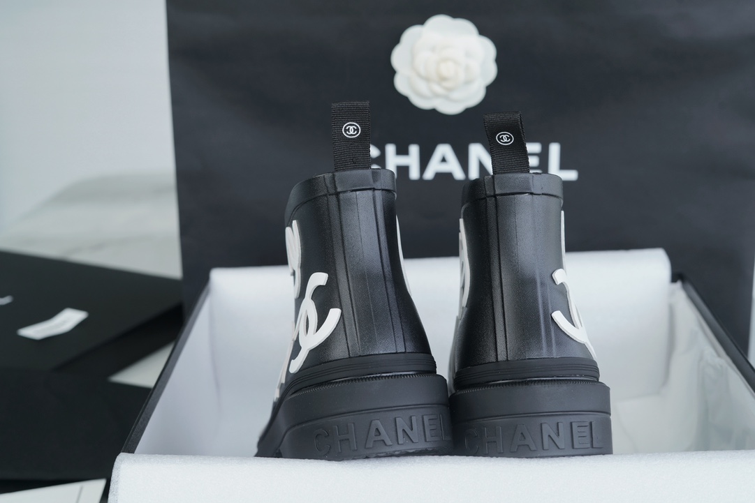 Chanel 23a Black Double C Full Logo Short Rain Boots: Made with Environmentally Friendly Lightweight Rubber Imported from Italy, Inner Fabric Lining Provides Softness, Giving a Feeling of Walking on Clouds. The Displaced Distribution of Logos Instantly El