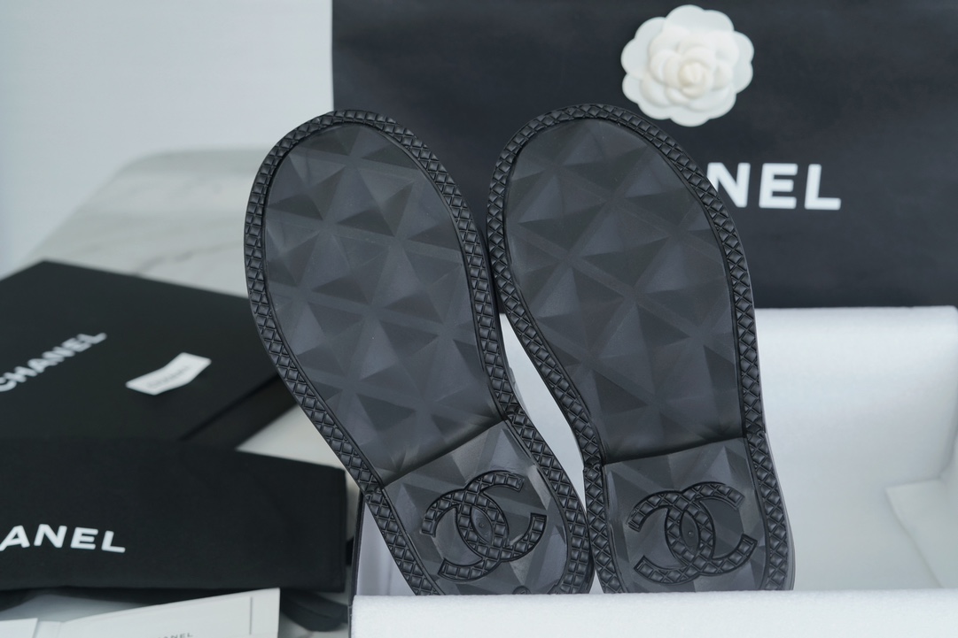 Chanel 23a Black Double C Full Logo Short Rain Boots: Made with Environmentally Friendly Lightweight Rubber Imported from Italy, Inner Fabric Lining Provides Softness, Giving a Feeling of Walking on Clouds. The Displaced Distribution of Logos Instantly El