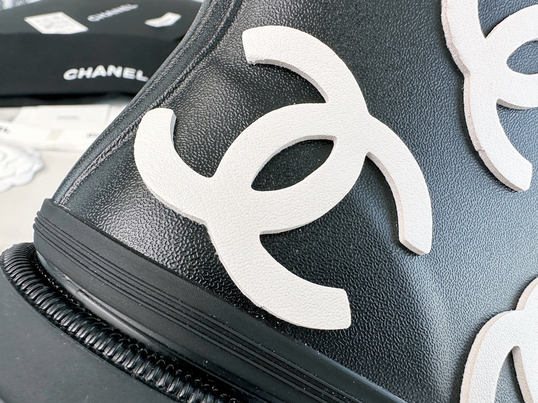 Chanel 23a Black Double C Full Logo Short Rain Boots: Made with Environmentally Friendly Lightweight Rubber Imported from Italy, Inner Fabric Lining Provides Softness, Giving a Feeling of Walking on Clouds. The Displaced Distribution of Logos Instantly El