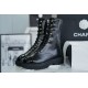 Chanel 23C Black Lace-Up Martin Boots: Crafted with sleek calfskin and patent leather