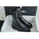 Chanel 23C Black Lace-Up Martin Boots: Crafted with sleek calfskin and patent leather