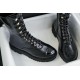 Chanel 23C Black Lace-Up Martin Boots: Crafted with sleek calfskin and patent leather