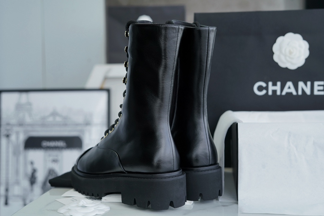 Chanel 23C Black Lace-Up Martin Boots: Crafted with sleek calfskin and patent leather