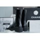 Chanel 23C Black Lace-Up Martin Boots: Crafted with sleek calfskin and patent leather