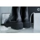 Chanel 23C Black Lace-Up Martin Boots: Crafted with sleek calfskin and patent leather