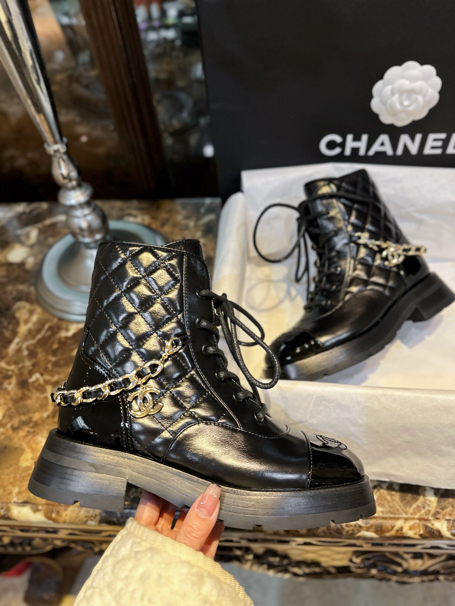 Chanel 23a Chain Martin Boots: Featuring a classic diamond-pattern design, glossy cowhide leather combined with genuine leather rubber six-layer composite sole