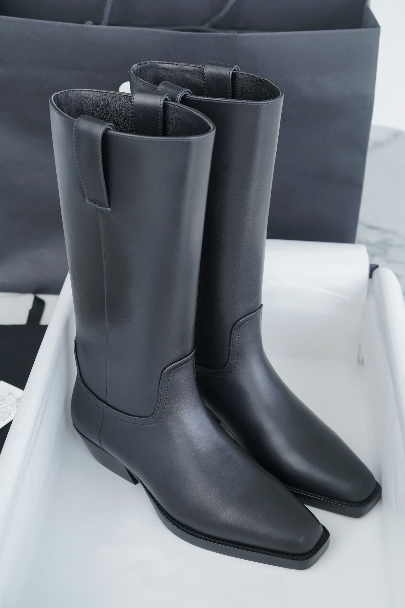 Chanel  23s Square-Toe Knight Boots: Crafted from imported cowhide with fine pores