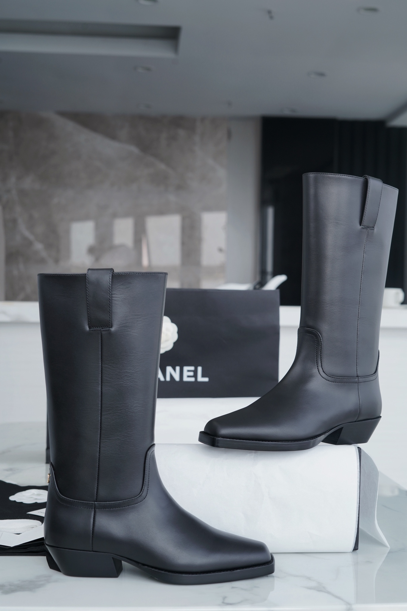 Chanel  23s Square-Toe Knight Boots: Crafted from imported cowhide with fine pores