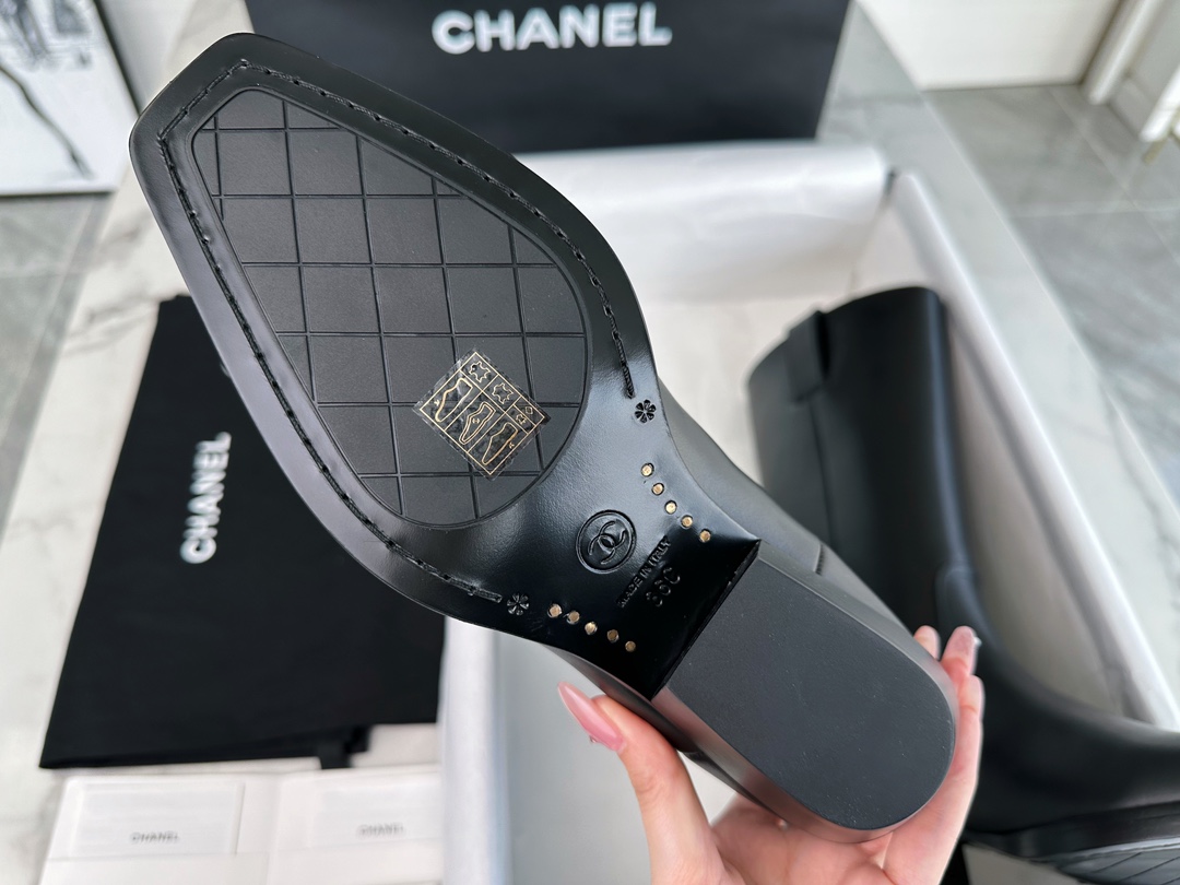 Chanel  23s Square-Toe Knight Boots: Crafted from imported cowhide with fine pores