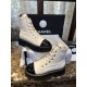 Chanel  23b Chunky Sole Martin Ankle Boots: Featuring a combination of white lychee-patterned cowhide and black oil-wax leather