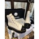 Chanel  23b Chunky Sole Martin Ankle Boots: Featuring a combination of white lychee-patterned cowhide and black oil-wax leather