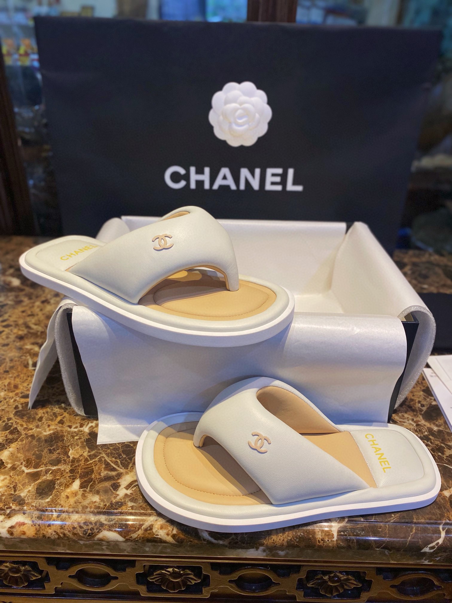 Chanel White Plush Flip Flops: Lightweight, Superior Comfort with Sheepskin-wrapped Footbed and Foam Outsole