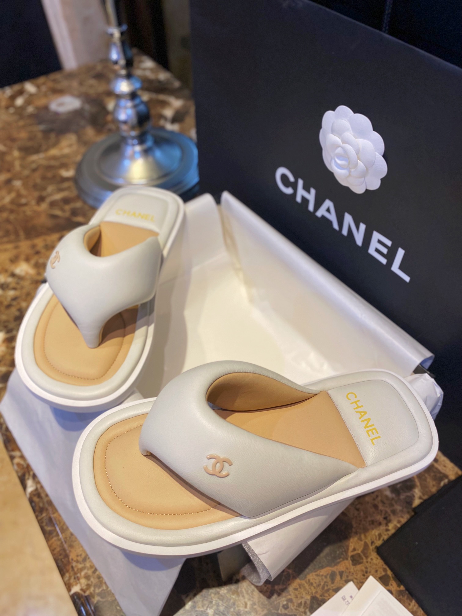 Chanel White Plush Flip Flops: Lightweight, Superior Comfort with Sheepskin-wrapped Footbed and Foam Outsole