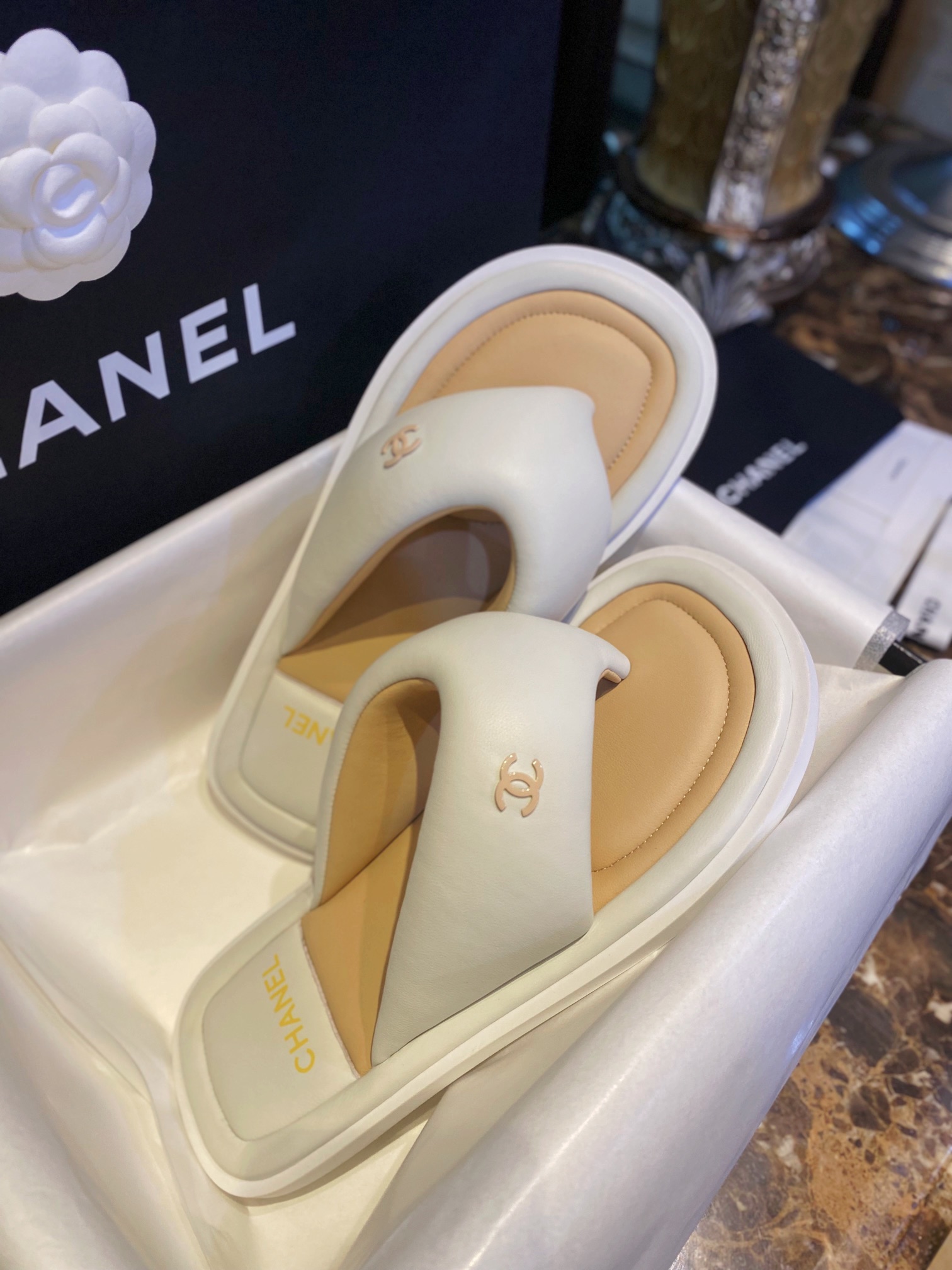 Chanel White Plush Flip Flops: Lightweight, Superior Comfort with Sheepskin-wrapped Footbed and Foam Outsole