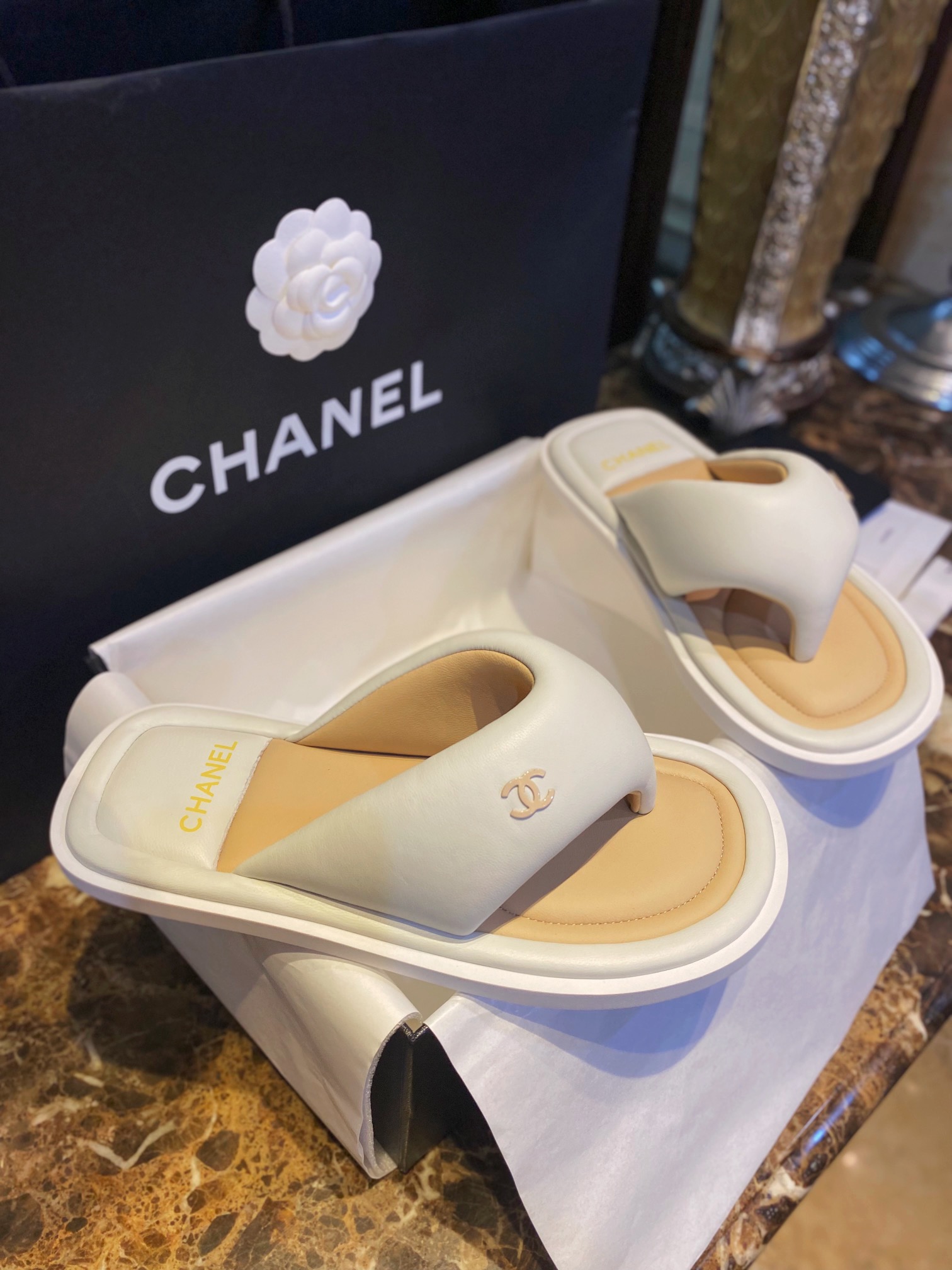 Chanel White Plush Flip Flops: Lightweight, Superior Comfort with Sheepskin-wrapped Footbed and Foam Outsole