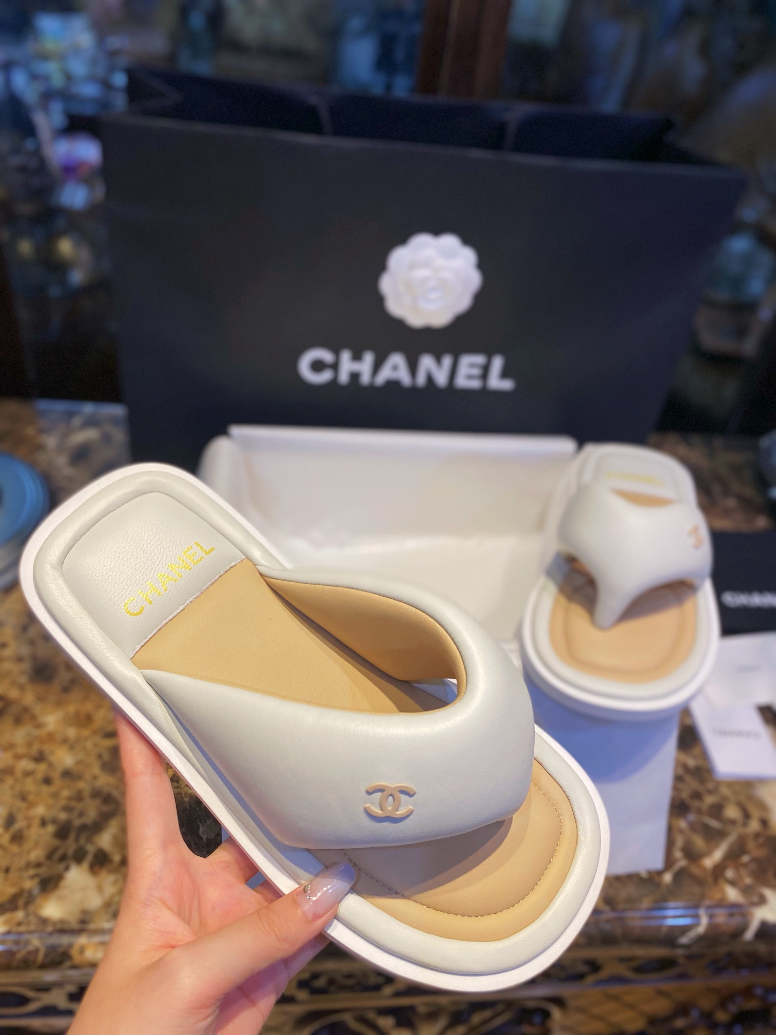 Chanel White Plush Flip Flops: Lightweight, Superior Comfort with Sheepskin-wrapped Footbed and Foam Outsole