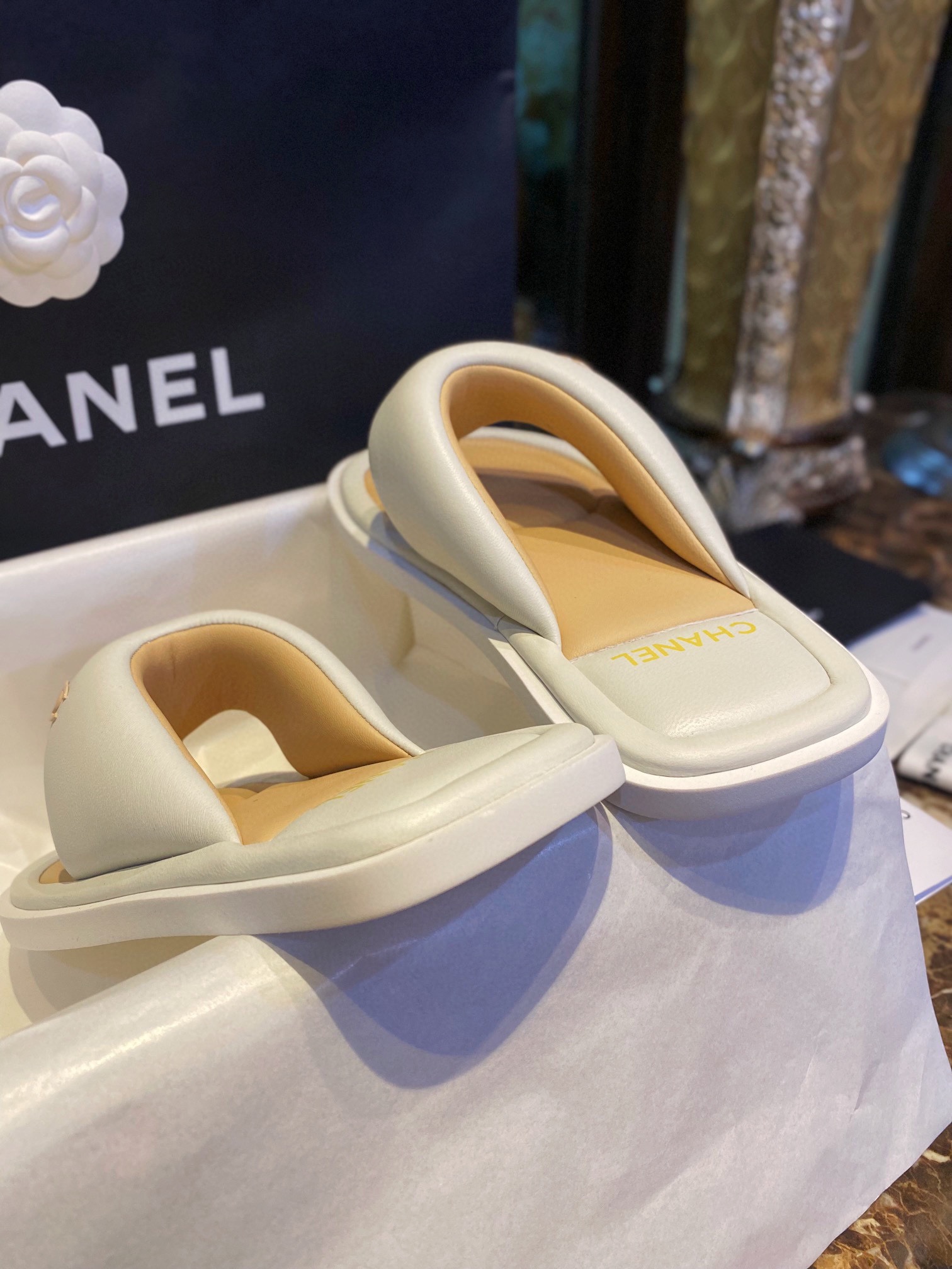 Chanel White Plush Flip Flops: Lightweight, Superior Comfort with Sheepskin-wrapped Footbed and Foam Outsole