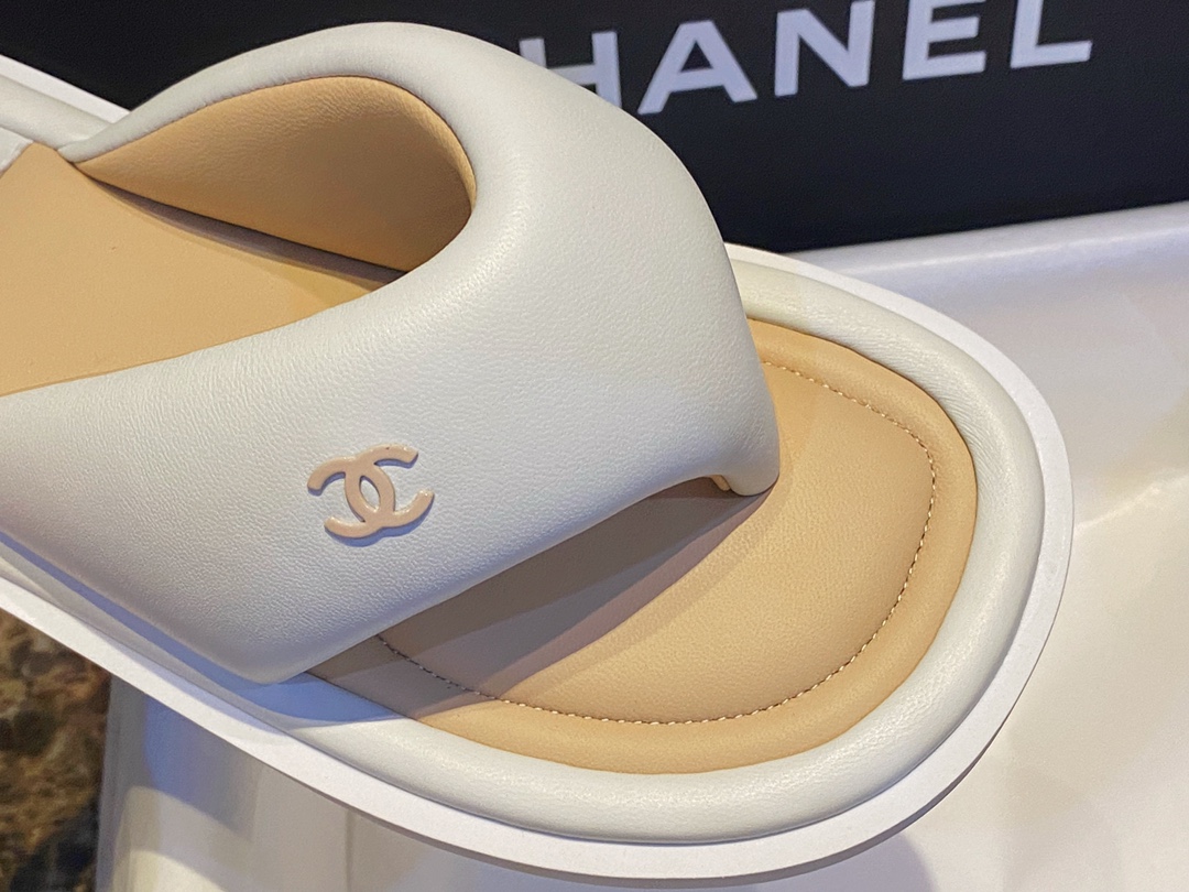 Chanel White Plush Flip Flops: Lightweight, Superior Comfort with Sheepskin-wrapped Footbed and Foam Outsole