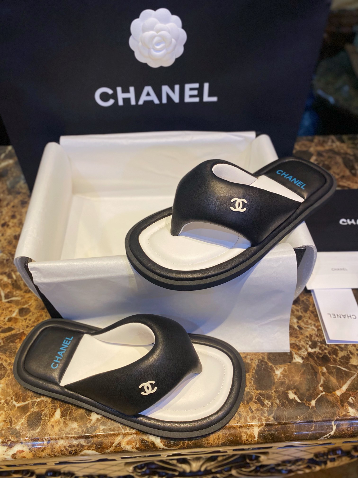 Chanel  Black Plush Flip Flops: Lightweight, Superior Comfort with Sheepskin-wrapped Footbed and Foam Outsole 