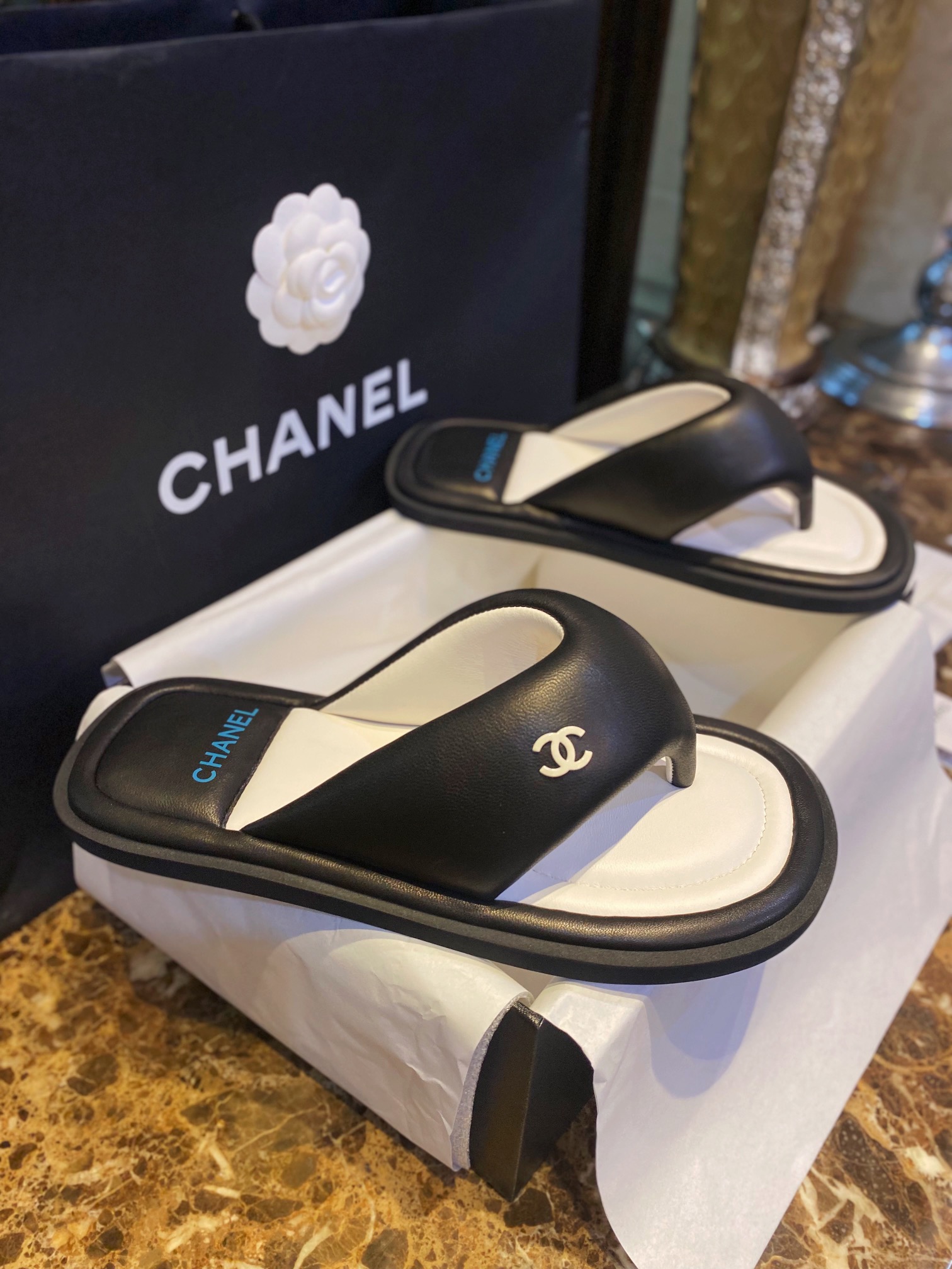 Chanel  Black Plush Flip Flops: Lightweight, Superior Comfort with Sheepskin-wrapped Footbed and Foam Outsole 