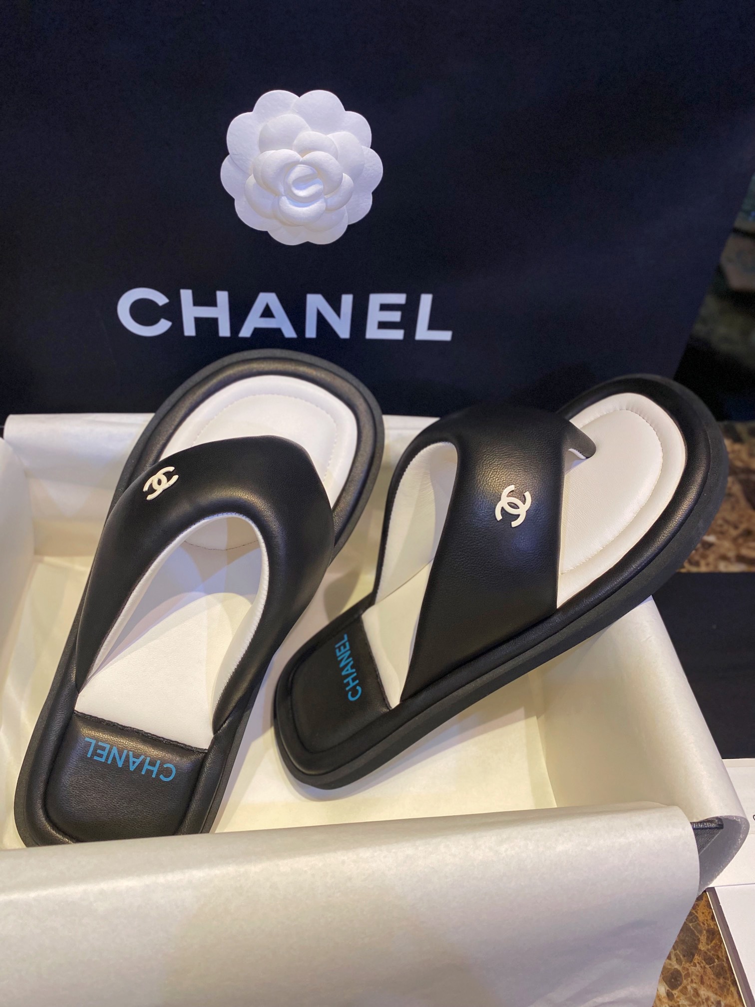 Chanel  Black Plush Flip Flops: Lightweight, Superior Comfort with Sheepskin-wrapped Footbed and Foam Outsole 