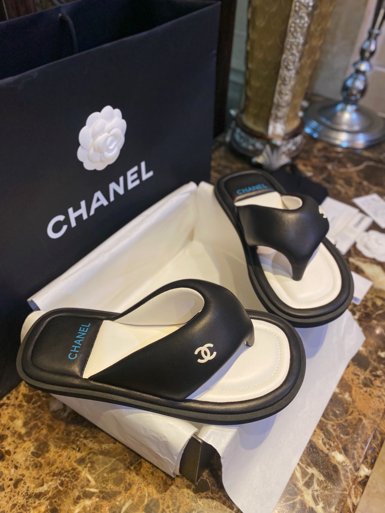 Chanel  Black Plush Flip Flops: Lightweight, Superior Comfort with Sheepskin-wrapped Footbed and Foam Outsole 