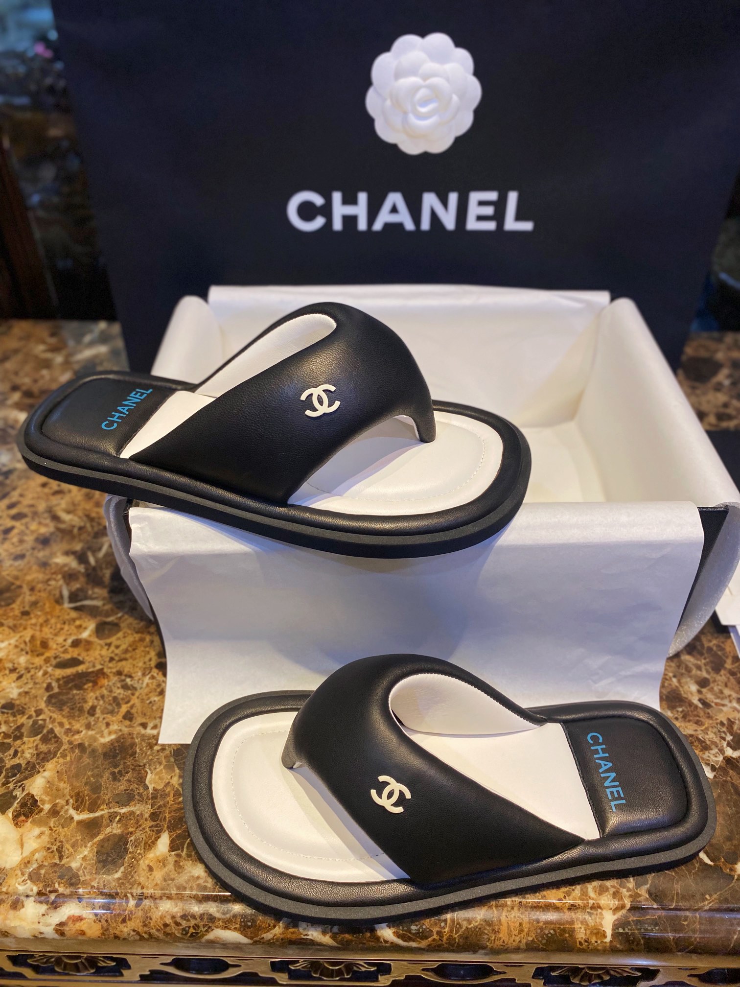 Chanel  Black Plush Flip Flops: Lightweight, Superior Comfort with Sheepskin-wrapped Footbed and Foam Outsole 