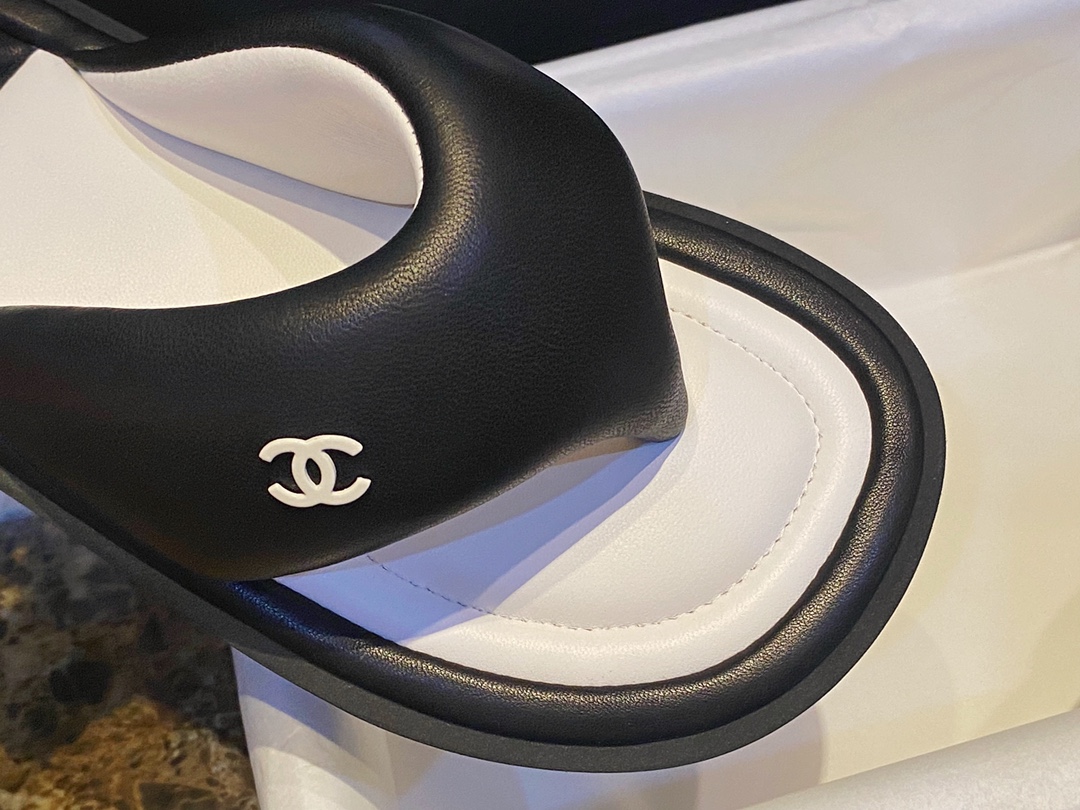 Chanel  Black Plush Flip Flops: Lightweight, Superior Comfort with Sheepskin-wrapped Footbed and Foam Outsole 