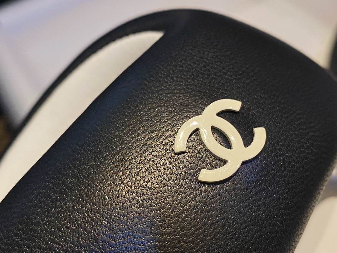 Chanel  Black Plush Flip Flops: Lightweight, Superior Comfort with Sheepskin-wrapped Footbed and Foam Outsole 