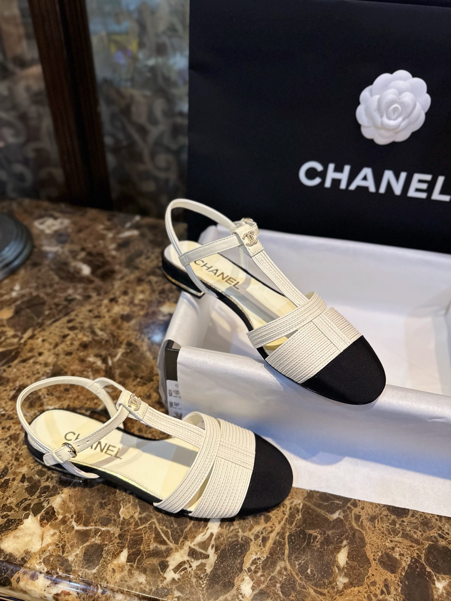 Chanel Black Sheepskin Woven Flat Sandals with Pearl Embellishments