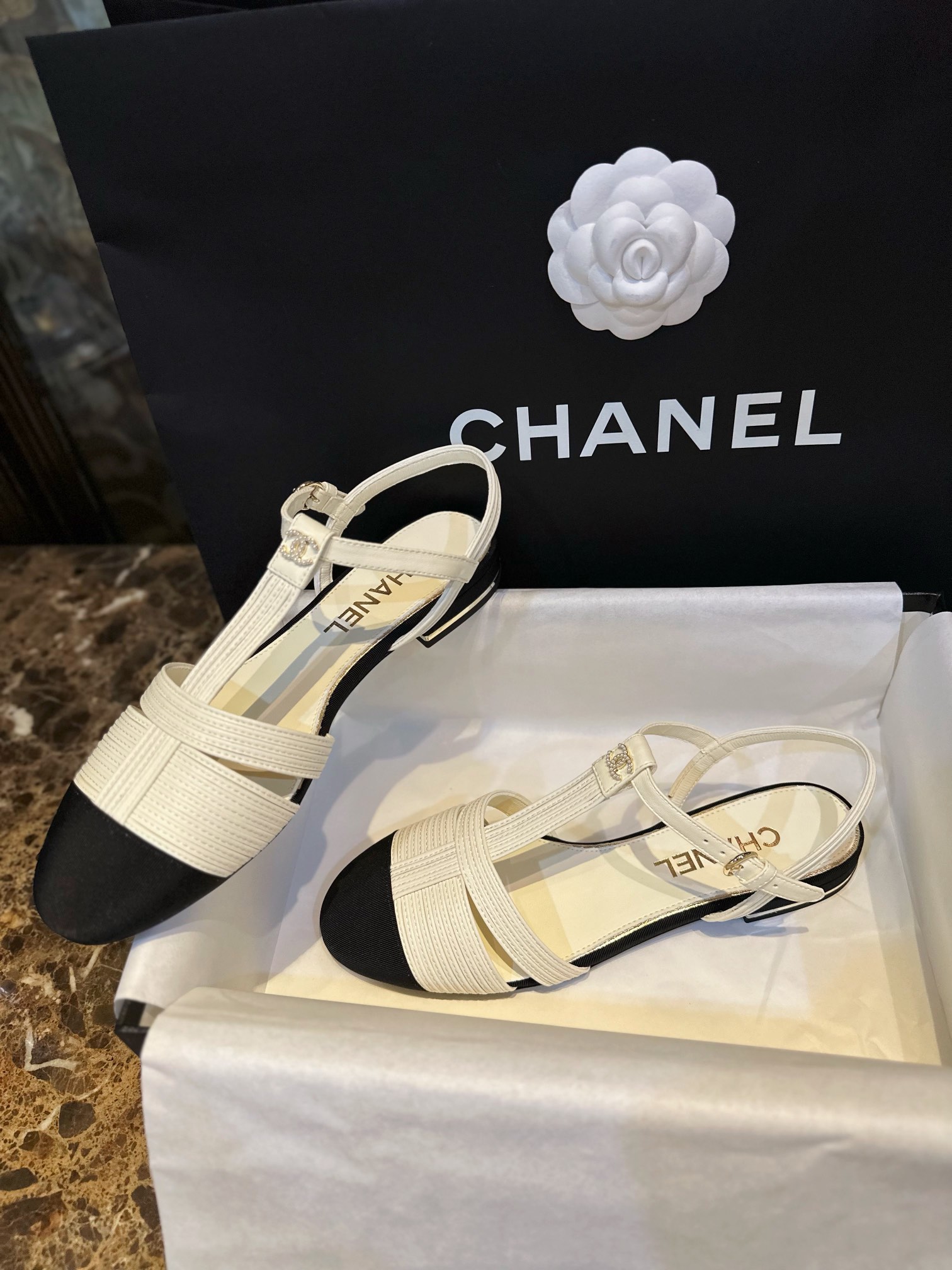 Chanel Black Sheepskin Woven Flat Sandals with Pearl Embellishments