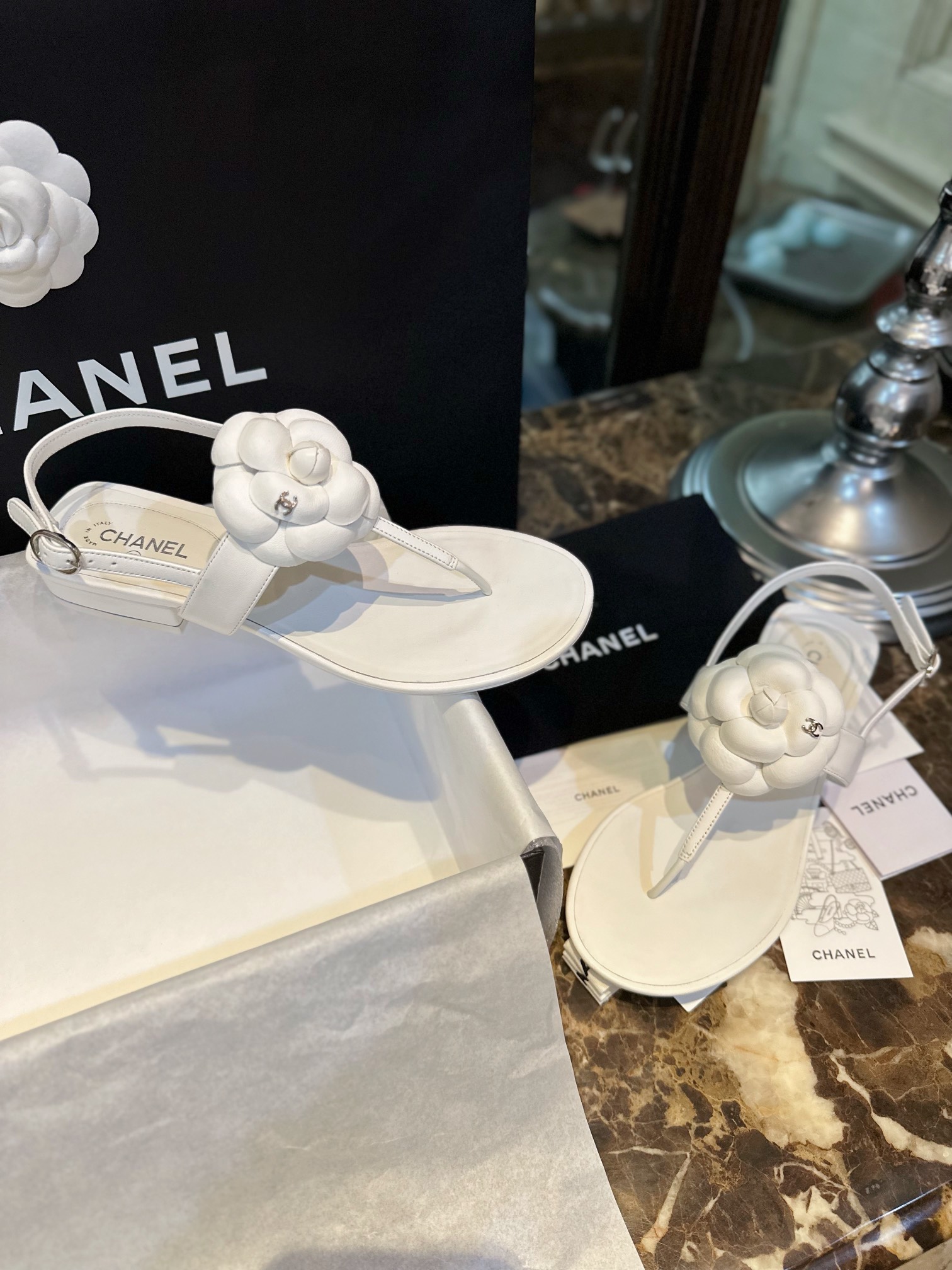 Chanel All White Camellia Sandals: Elegant Toe-Strap Design with Pure Dyed Sheepskin and Leather Sole