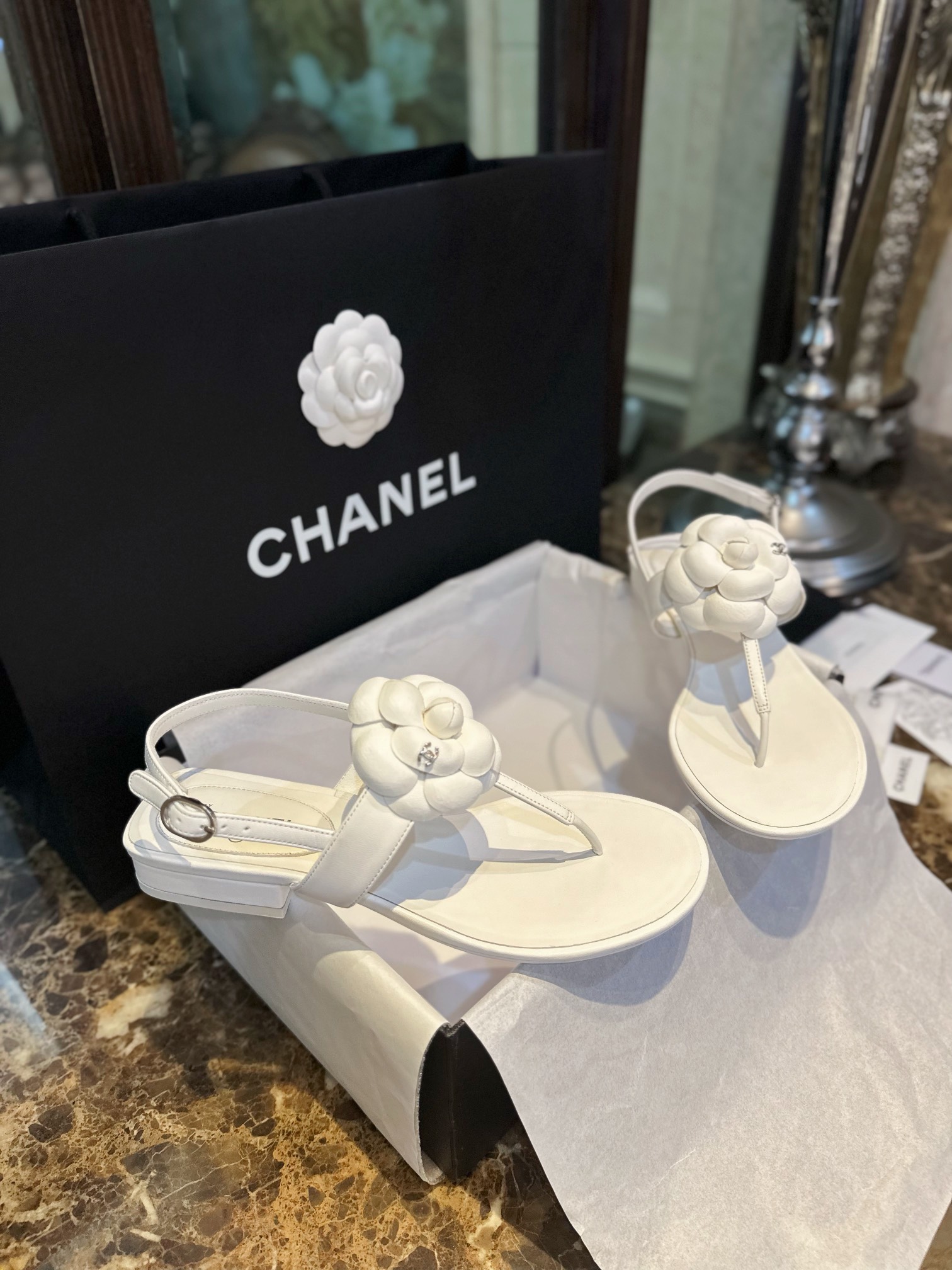 Chanel All White Camellia Sandals: Elegant Toe-Strap Design with Pure Dyed Sheepskin and Leather Sole