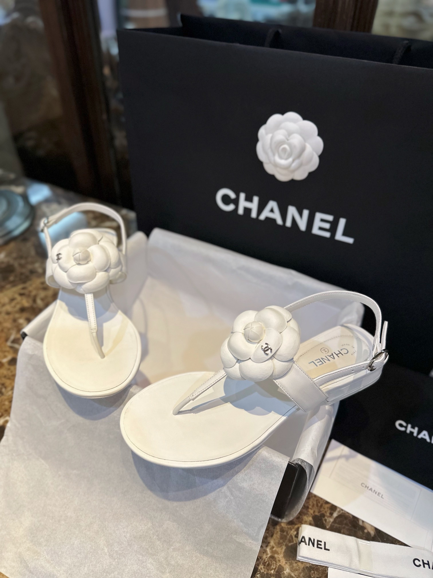 Chanel All White Camellia Sandals: Elegant Toe-Strap Design with Pure Dyed Sheepskin and Leather Sole