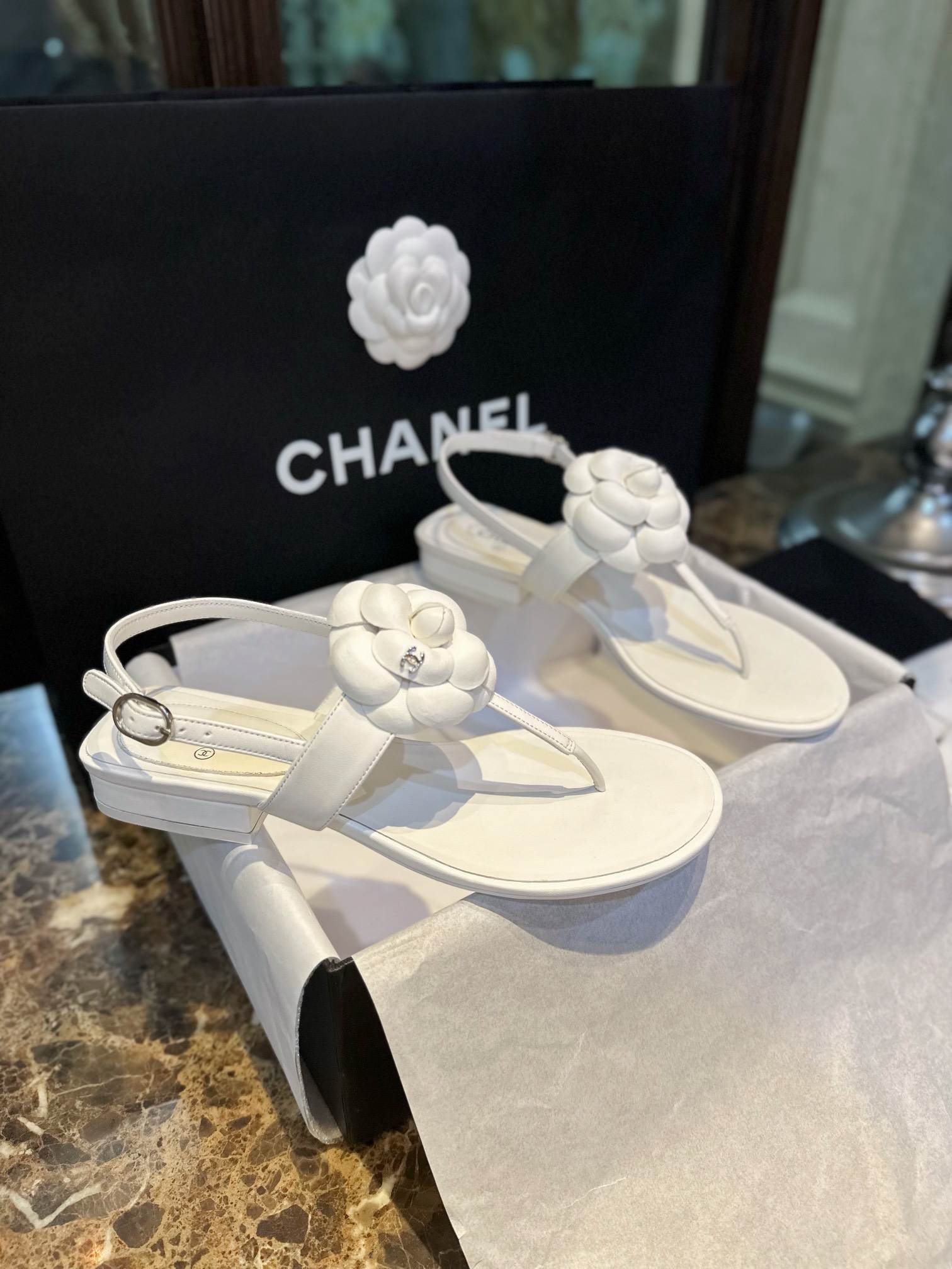 Chanel All White Camellia Sandals: Elegant Toe-Strap Design with Pure Dyed Sheepskin and Leather Sole